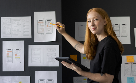 website planning and strategy session reviewing wireframes and mobile layout concepts